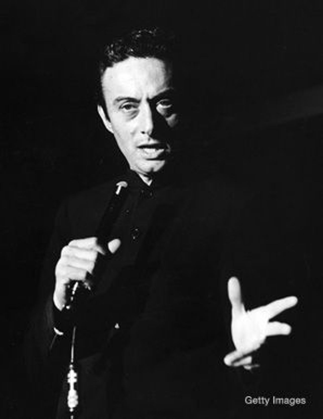 Lenny Bruce performing with a microphone